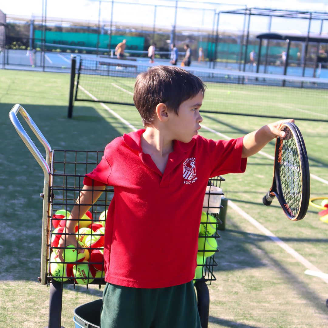 Junior players at a Hot Shots tennis class at Rushcutters Bay Park Tennis