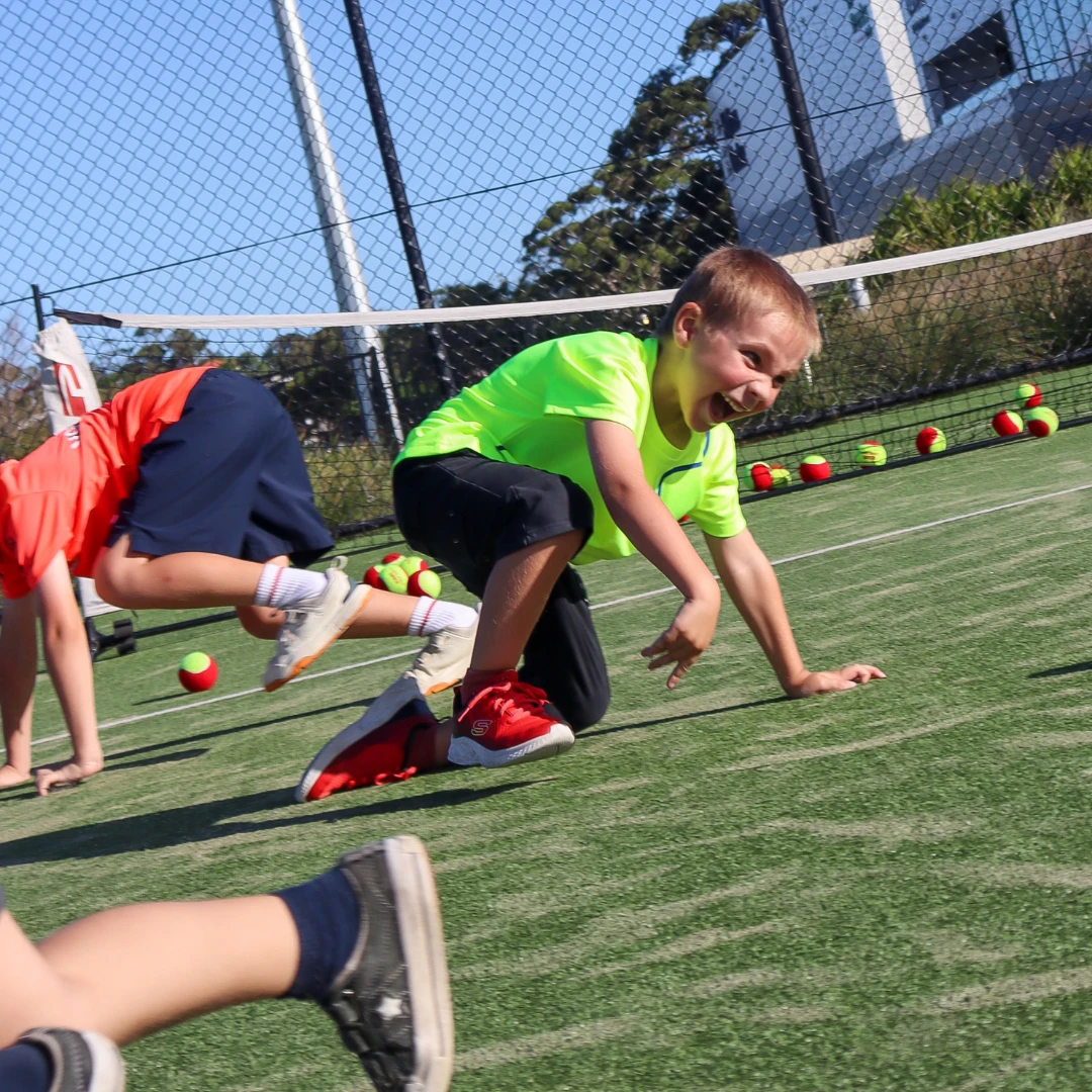 Kids playing tennis at Rushcutters Bay Park